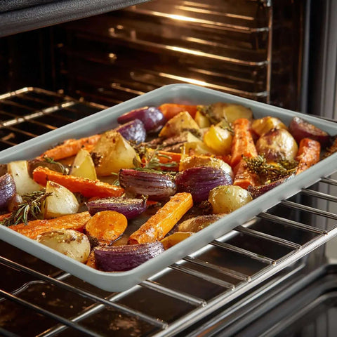 Ceramic Nonstick Baking Sheet For Oven Cookin 15x10 Inches Durable Aluminum Tray With PTFE And PFOA Free Coating in oven with roasted vegetables