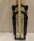 20 Inch Suspension Fork With Coil Spring And Preload, 63mm Travel, shown with measuring tape for height reference.