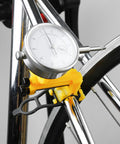 Pro Grade Wheel Turning Stand With Dial Indicator For Precise Bike Wheel Alignment And Repair At Home, close-up on dial gauge