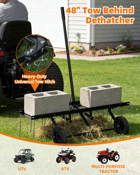 48 Inch Tow Behind Dethatcher with 24 rustproof tines and heavy-duty tires attached to a lawn tractor in a garden setting.