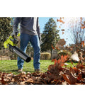 Heavy Duty Cordless Leaf Blower Pumping 110 Mph And 525 CFM With Variable Speed Settings For fast yard cleanup, man using blower on leaves.