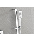 Wall Mounted Waterfall Rain Shower System with 3 Body Sprays & Handheld, chrome handheld showerhead against gray wall.