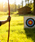 Archery practice with 20 Inch Straw Archery Target With Handle Backyard Practice Kit Includes Replacement Target Papers With Scoring Rings Pins And Arrow Puller Fits Recurve And Compound Bows All In One Target Set outdoors.
