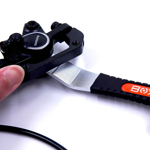 Extended Hydraulic Piston Press For Bicycle Disc Brakes Caliper Pad Spreader Tool With Longer Handle And Extended Tip For Safe Brake Maintenance Durable Dual Density Grip Ergonomic Design For Easy Fatigue Free Service, black bike caliper tool