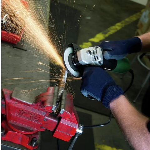 4.5-inch angle grinder with 6.2A motor in use, sparks flying, gripping handle, four and a half inch angle grinder with five grinding wheels and hard case
