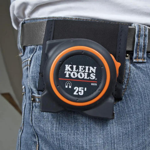 Heavy Duty Nylon Tape Measure Holder With Belt Tunnel For 2.25 Inch Belts attached to jeans, displaying 25' tape measure.