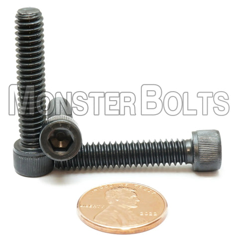 1/4-20 X 1-1/4 Socket Head Cap Screws High Strength A574 Alloy Steel Black Oxide, showing three bolts with a penny for scale.