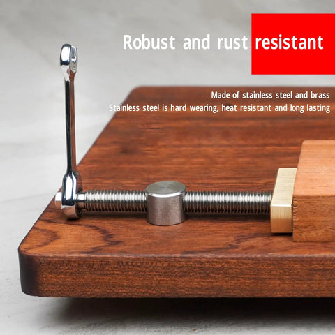Close-up of 2 Pack Bench Dog Clamps for 20mm or 7.9 inch holes, stainless steel body with brass block on a wooden desktop.