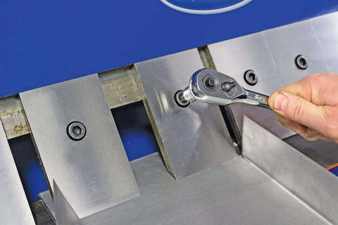 Adjusting removable fingers on 48 Inch Pan And Box Sheet Metal Brake with ratchet tool for precise 135 degree bends and versatility.