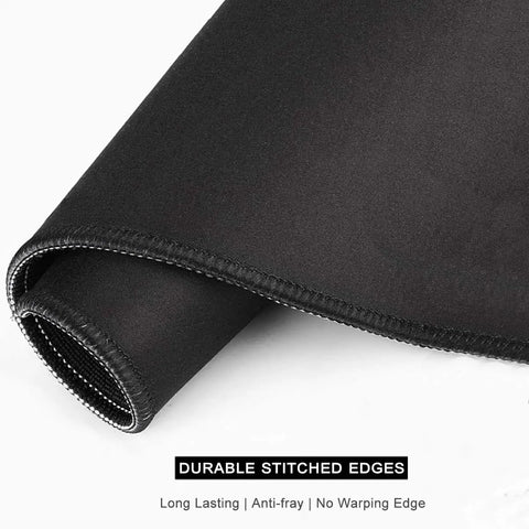 Close-up of black mouse pad showing durable stitched edges, a feature of the Beach Theme Mouse Pad 12x10 Inch For Desk Setup Waterproof Non Slip Rubber.
