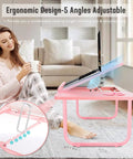 Woman using Multiuse Bed Lap Desk With Tilted Angles For Laptops, Candy Pink, ergonomic design on couch.
