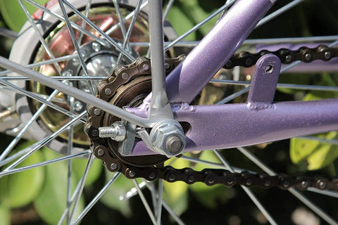 Close-up of a Single Speed Bike Chain For Fixed Gear And Mountain Bikes One Half By One Eighth Inch 116 Links Tough As Nails on rear wheel