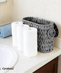 Toilet Paper Storage Basket With Lid Made From Water Hyacinth Wicker Built In Handles Holds Up To 6 Mega Rolls in bathroom setting