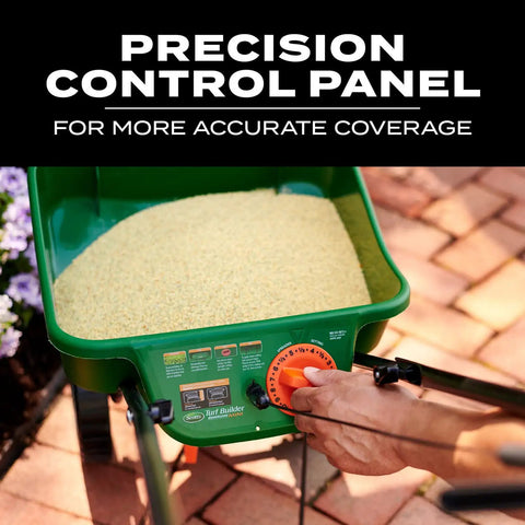 Close-up of Turf Builder EdgeGuard Mini Broadcast Spreader control panel with hand adjusting knob, filled with yellow fertilizer.
