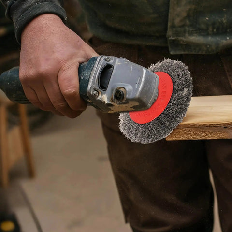 Person using 6 Piece Angle Grinder Wire Wheel Set With 4.5 Inch And 4 Inch Knotted Coarse Crimped Wheels Five Eighths Inch Eleven Threaded Arbor Built Tough Attachments For Rust Removal Deburring Sanding And Surface Prep on wood