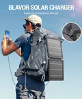 Hiker using On The Go 10W Foldable Solar Charger With USB C And USB A Outputs IPX4 Waterproof Portable Solar Panel on backpack