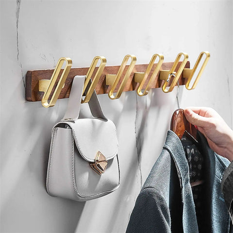 Retro Double Wall Mount Coat Hook Badass Solid Build Hangs Your Coats Towels and Hats like a Pro Sweet Vintage Finish with purse on wooden wall panel.