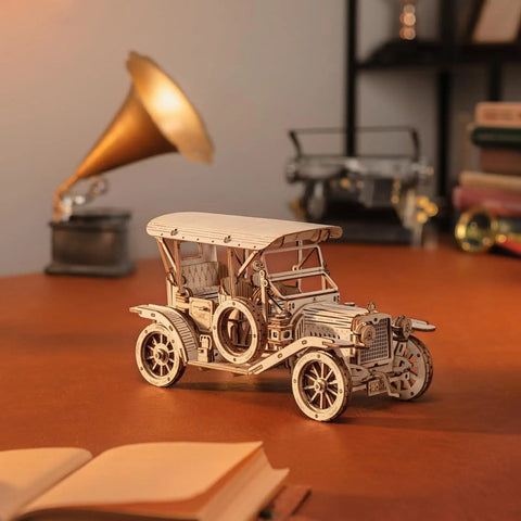 3D Wooden Puzzle Car Kit For Adults And Teens One To Fifteen Scale Vintage 1910s Classic Car Model on table, assembled.