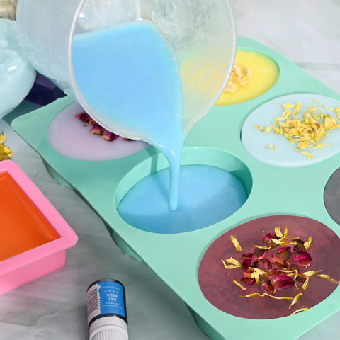 All In One Soap Making Kit For Adults And Teens With Shea Butter Glycerin Melt And Pour Bases shown with colored soap molds and dried petals.