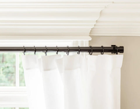Top Tier Premium Metal Curtain Rings With Quiet Smooth Removable Nylon Inserts Pinhooks And Clips Included One Point Five Inch Inside Diameter 18 Rings For Two Standard Curtains Ultra Sleek Tuxedo Black installed on a curtain rod