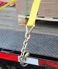 Beefy Two Strap System With 4 Inch By 30 Foot Heavy Duty Winch Straps With Chain End And Grab Hook Securing Load on Flatbed