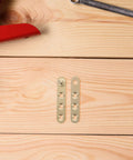 Two Pack Copper Concealed Door Hinges With Noise Reduction And Wide Rotation Angle on wooden surface