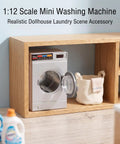 Dead On Realistic 1:12 Scale Mini Drum Washing Machine For Dollhouse Kitchen Setup in wooden shelf with laundry basket.