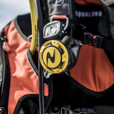 Compact Scuba Octopus Regulator with high visibility yellow hose attached to diving gear, showing pneumatically balanced second stage.