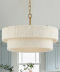Hand Woven Rattan Chandelier Serving Real Boho Vibes And Adjustable Coastal Design; cream fabric, two-layered shade over kitchen.