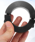 Hand holding a black 4 Pack Double Split Shaft Collars 45mm Bore 73mm Outer Diameter 19mm Thick Black Oxide Locking Clamp with Set Screws