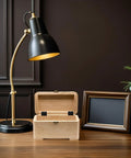 Black Iron Wardrobe Door Hinge Set, 20 Pieces, Six Hole Mounting shown on a light wooden jewelry box with a black table lamp nearby.