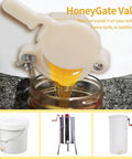 Food Grade Plastic Honey Gate Valve Set For 5 Gallon Buckets with nylon barrel and stainless screws, honey flowing from valve