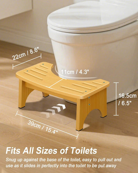 Eco Friendly Bamboo Toilet Stool Six Point Five Inch For Bathroom Squat Potty With Dual Anti Slip Feet next to a toilet