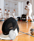 Stainless Steel Fencing Hand Guard And Practice Protector For Adults Pro Grade Durable Injury Resistant Shield in a dojo
