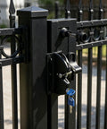 INOOMP 1Set Gate Lock for Outdoor Fence, 2-Sided Self-Locking Latch w Key attached to a black metal gate post.