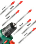 Front view of a cordless drill with 6 mm tile drill bits; orange tips, 20-piece cemented-carbide set.