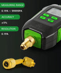 Wisscool digital micron vacuum gauge, front view, with 1/4 SAE brass fitting, LCD display, green button panel.