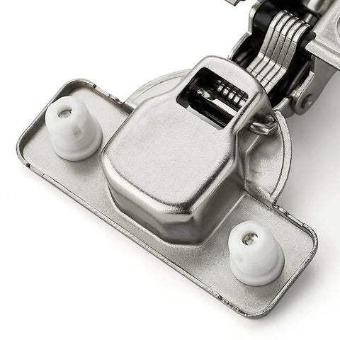 Close-up of brushed nickel short arm cabinet hinges for kitchen cupboards with half inch overlay heavy duty build.