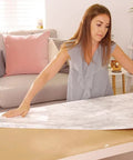 Woman using Grey Marble Peel And Stick Self-Adhesive Film Roll 17 Inch By 78 Inch for table DIY makeover in living room.