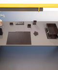 Top view of a desk with a sleek Leather Desk Organizer Set For Home Office And Office Desk Accessories Bonded Leather Craft In Rich Colors.