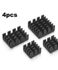 Four black heatsinks for Raspberry Pi 4 Starter Kit With Fan Cooled ABS Case And 4GB Model B Board Plus Essential Accessories.