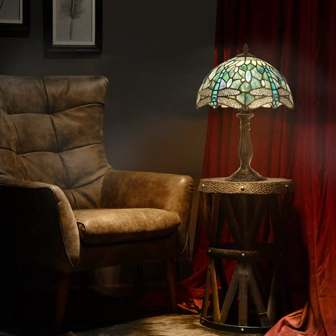 Dragonfly Tiffany Style Table Lamp With Stained Glass Shade, Bronze Base, 18 Inch Tall Bedside And Desk Light next to a chair