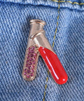 4 Piece Chemistry Beaker Brooch Set With Flask Design, Metal Alloy Scientist Lapel Pin on denim displaying red and pink details