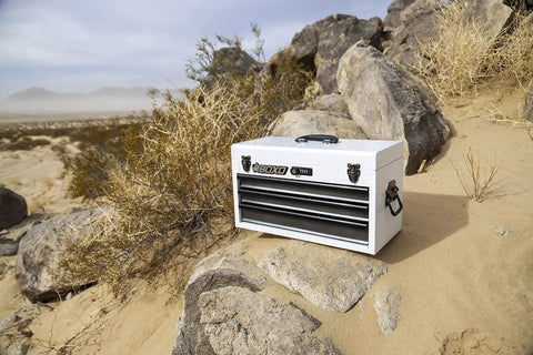 Heavy Duty 3 Drawer Steel Tool Box With Locking System in white, portable toolbox for mechanics and pros, on rocky desert terrain.