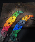 Colorful Eagle Head Embossed Folding Pocket Knife With Damascus Pattern Blade EDC on leather background