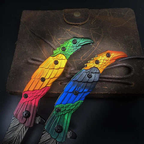 Colorful Eagle Head Embossed Folding Pocket Knife With Damascus Pattern Blade EDC on leather background