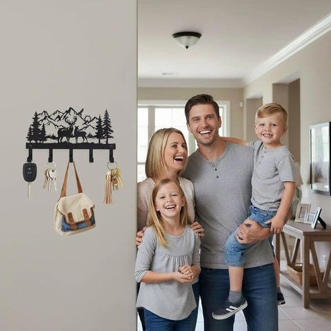 Deer Mountain Metal Key Holder Wall Mount For Rustic Cabin Decor Key Rack with Hooks installed in a family entryway.
