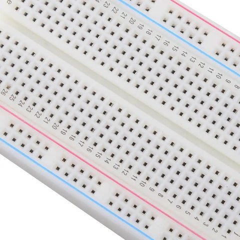 Close-up of Compact Mini Breadboard With 400 Tie Points And Dual Power Lanes For Arduino Projects Measuring 5.5 By 8.2 By 0.85 Cm