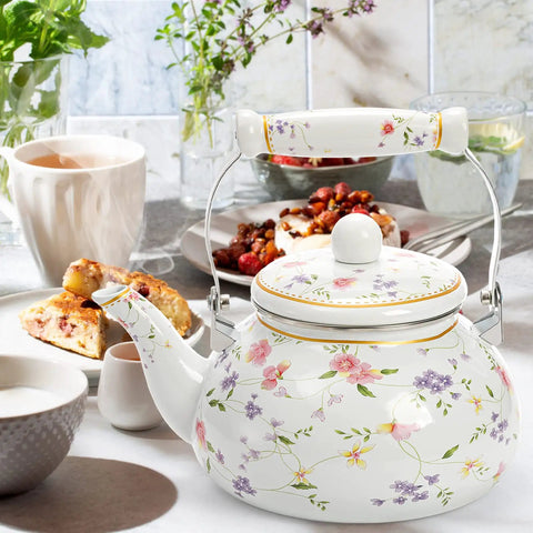 Vintage Floral Enamel Tea Kettle 2.6 Quart With Porcelain Handle for stovetop kitchen use, surrounded by breakfast setting.