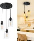 Sleek 3 Light Cluster Pendant In Black With Clear Glass Shades Adjustable Vintage Hanging Light For Kitchen Island Dining Room Foyer And Hallway E26 Base Fixture in modern kitchen setting